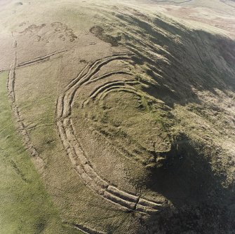 Woden Law, fort and associated monuments: air photograph under conditions of low light.
RCAHMS, 1994.