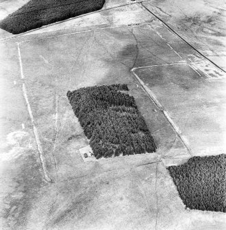 Pennymuir, oblique aerial view, taken from the SSW, centred on two Roman Temporary Camps and a linear earthwork. An area of rig and the course of 'Dere Street' are visible in the top right-hand corner of the photograph.