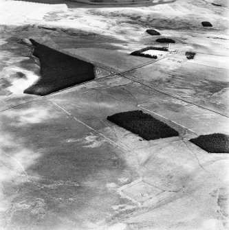 Pennymuir, oblique aerial view, taken from the SW, centred on Roman Temporary Camps and a linear earthwork. The course of 'Dere Street' is visible in the centre of the photograph.