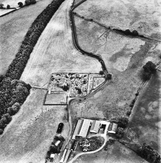 Holywood Abbey, oblique aerial view, taken from the WNW, centred on the cropmarks around the Abbey, and showing linear cropmarks in the top right-hand corner of the photograph.