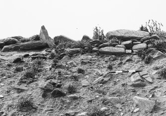 Wainwright's site (Area 6, 1980).  Building eroding out of cliffside.