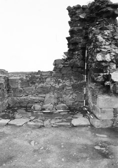 Excavation photograph - fireplace 2 - showing salt-box, fire back and hearth stones