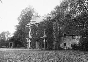 Copy of historic photographic view of farmhouse from S.