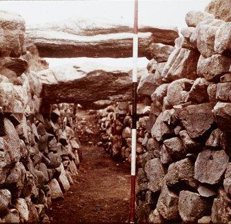 Excavation photograph - view along souterrain passage towards entrance.
