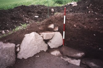 View of NW corner of the excavation trench. Scale in 200mm divisions