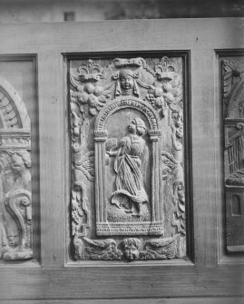 Interior.
Detail of carved panel on wooden seat.
