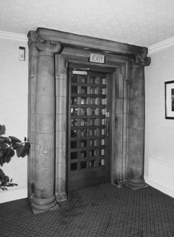 Entrance hall, original doorway with Ionic stone columns on either side, detail