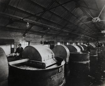 Photographic copy of Interior view in Nitro-cotton Department - pulping and finishing house showing  pulpers