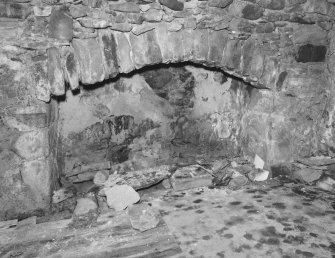 Interior.
Detail of the fireplace in the kitchen, vaulted chamber at the E end.