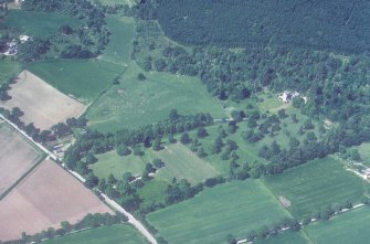Castle Leod.
Oblique aerial view, taken from the NE, showing the tower-house and a possible golf course.