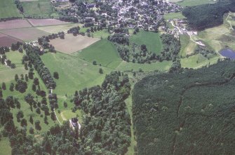 Castle Leod.
Oblique aerial view, taken from the NW, centred on the tower-house and a possible golf course. Strathpeffer is visible in the top half of the photograph.