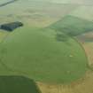 General oblique aerial view centred on the remains of the recumbent stone circle and rig, taken from the NW.