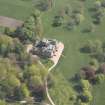 Oblique aerial view centred on the country house, taken from the NNW.