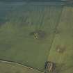 Oblique aerial view centred on the remains of the recumbent stone circle, taken from the WSW.