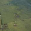 Oblique aerial view centred on the remains of the recumbent stone circle, taken from the S.
