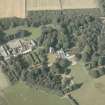 Oblique aerial view of the country house and farmsteading, taken from the SSW.