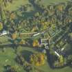 Oblique aerial view of the country house, stables and walled gardens, taken from the SW.
