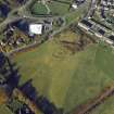 Oblique aerial view centred on the remains of the henge and stone circle, taken from the SE.