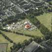 Oblique aerial view centred on the big red tent on The Meadows taken from the ENE.