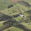 General oblique aerial view centred on the country house, garden, stable, footbridge and lake, taken from the ENE.