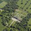 Oblique aerial view centred on the country house, garden and stable with the cottage, farmsteading and stable adjacent, taken from the WNW.