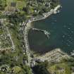 General oblique aerial view of the town centred on the pier, churches, gallery, whisky distillery, courthouse, jail and hotel, taken from the SW.