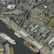 Oblique aerial view centred on the dock with the church, museum, cinema and high-rise flats adjacent, taken from the SE.