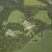 Oblique aerial view centred on the country house, stable block and walled garden, taken from the SSW.