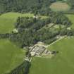 General oblique aerial view centred on the castle, tower-house, walled garden and farmsteading, taken from the S.
