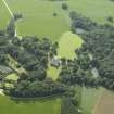 Oblique aerial view centred on the castle, tower-house and walled garden, taken from the NE.