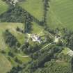 Oblique aerial view centred on the country house, dovecot, and remains of the chapel, taken from the SE.