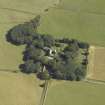 Oblique aerial view centred on the tower-house, stable, dovecot, cottage and walled garden, taken from the WSW.