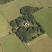Oblique aerial view centred on the tower-house, stable, dovecot, cottage and walled garden, taken from the SW.
