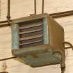 Interior.  Detail of wall mounted electric fan heater in Shed 3.