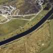Oblique aerial view centred on the quarry with the electricity generating station and bridge adjacent, taken from the WNW.