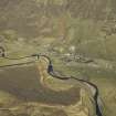 Oblique aerial view centred on the village and railway bridge with the road bridges and shooting lodge adjacent, taken from the ESE.