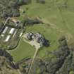 Oblique aerial view centred on the country house and walled garden, taken from the E.