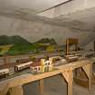 Interior. Main block, attic floor, view showing model train layout