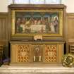 Interior. Detail of communion table by John Taylor & Sons with reredos of Last Supper designed and painted by M Meredith Williams and carved by Thomas Good.
