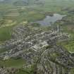 General oblique aerial view of the town with Carlingwark Loch beyond, taken from the NW.