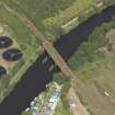 Oblique aerial view centred on the remains of the bridge with Western Railway Bridge adjacent, taken from the SSW.