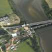 Oblique aerial view centred on the old bridge, rail bridge and new road bridge, with RAF Tornado passing, taken from the NE.