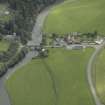 Oblique aerial view centred on the bridge with the farmsteading adjacent, taken from the WSW.