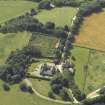 Oblique aerial view centred on the coach house and walled garden, taken from the NE.