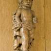 Interior.  Detail of carved wooden 'cherub' on panelling in Ante-Room.