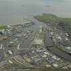 general oblique aerial view centred on the harbour, taken from the W.