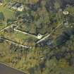 Oblique aerial view centred on the tower and burial ground, taken from the SW.