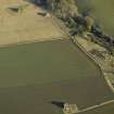 Oblique aerial view centred on the control tower with part of the domestic site adjacent, taken from the SW.