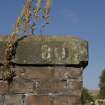 Detail of top of stone abutment on S side showing painted bridge number.