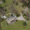 Oblique aerial view centred on the house with the walled garden adjacent, taken from the SW.
